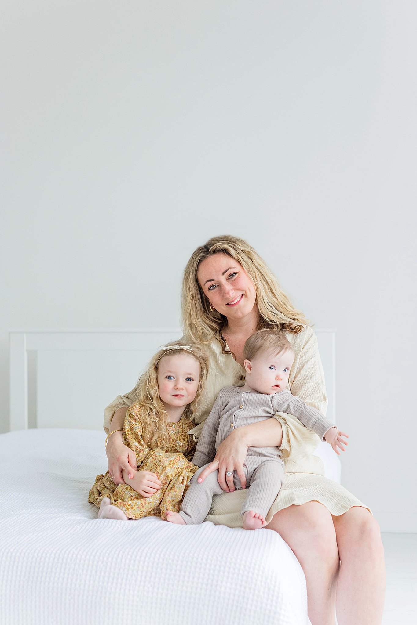 Mom with two kids during Motherhood pictures