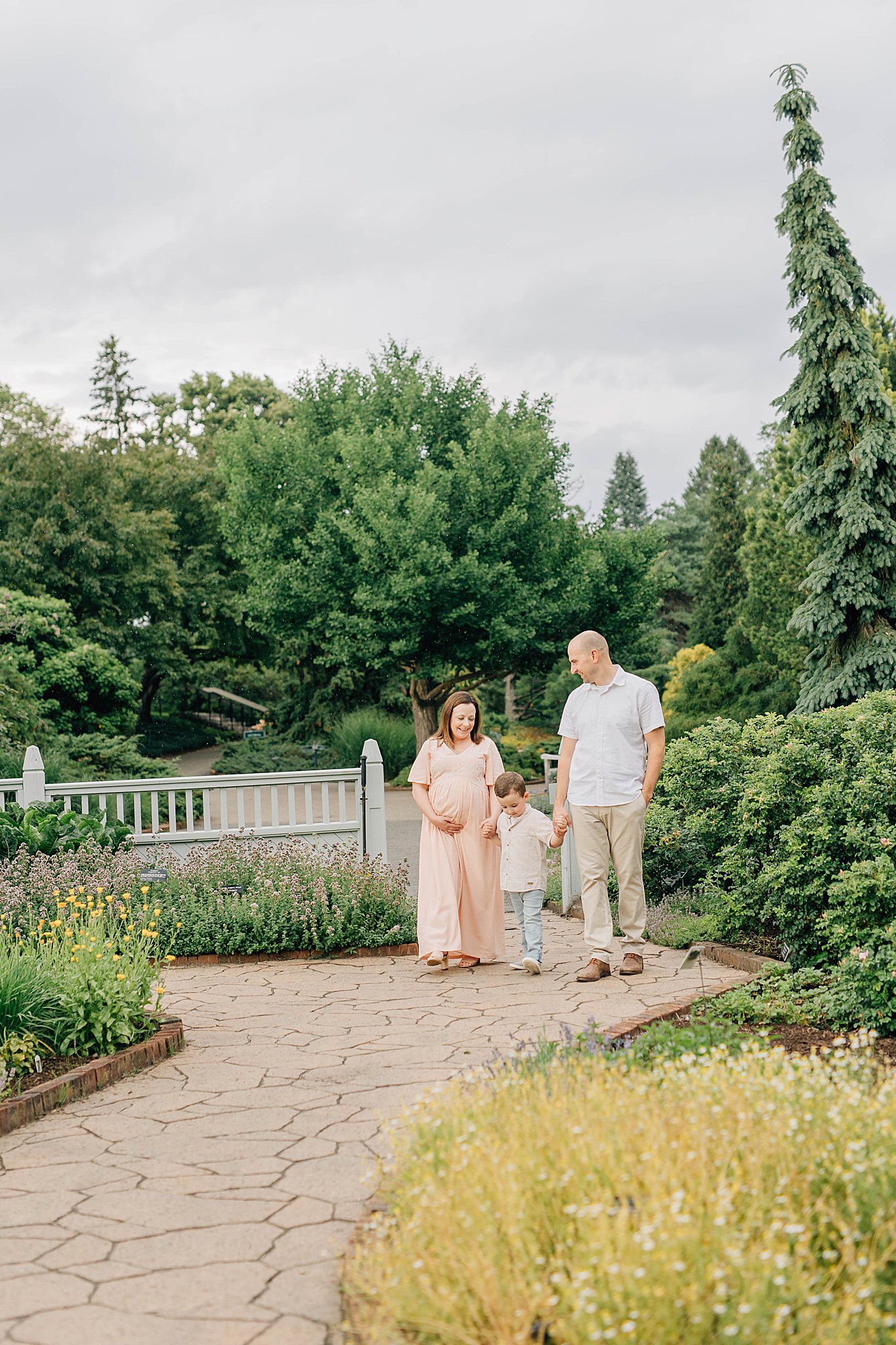 Summer Maternity photos with son, dad and momma walking.