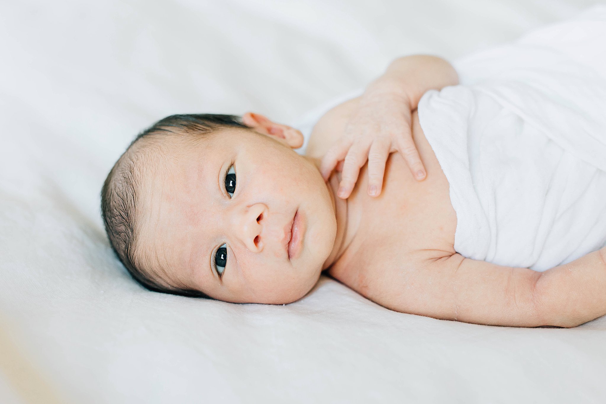 Baby boy at in-home newborn pictures.