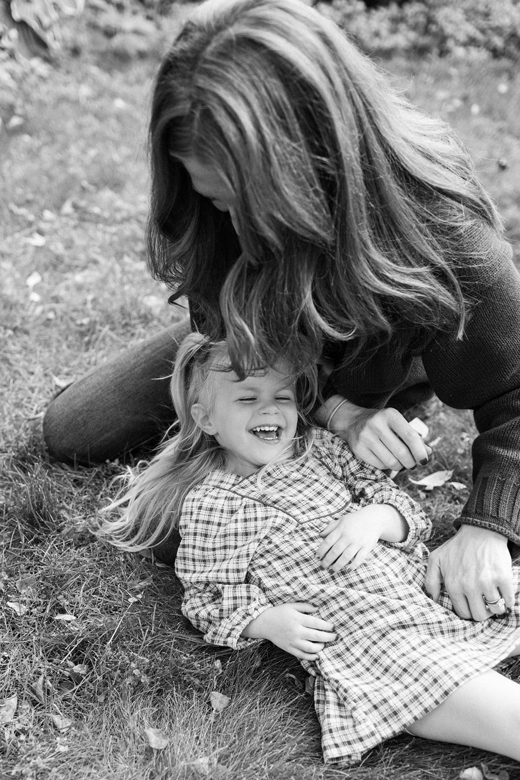 Mom and Daughter Photo on Lawn of House During Fall