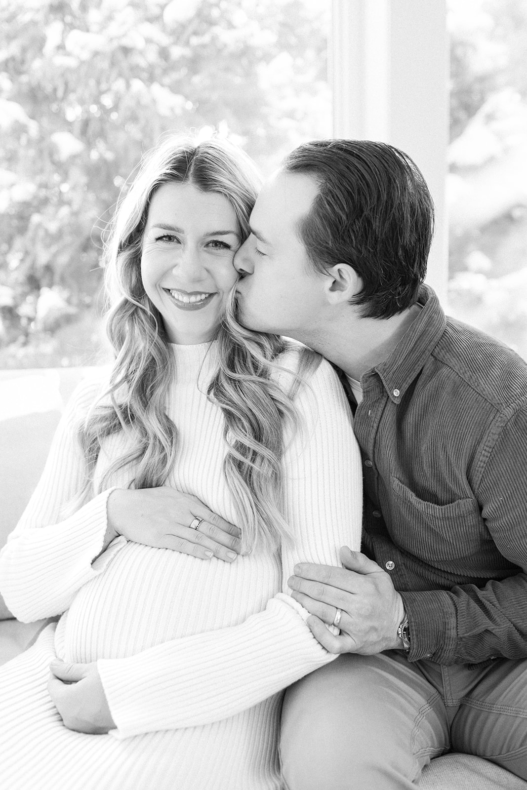 Mom and Dad Kiss During Family Photoshoot