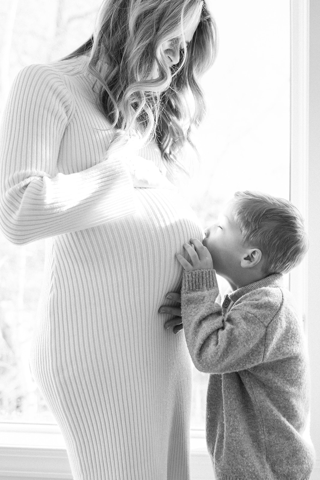 Toddler Boy Kissing Moms Pregnant Belly